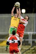 31 January 2015: Neill Gallagher, Donegal, in action against Mark Lynch, Derry. Allianz Football League Division 1, Round 1, Donegal v Derry. MacCumhail Park, Ballybofey, Co. Donegal Picture credit: Oliver McVeigh / SPORTSFILE