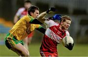 31 January 2015: Enda Lynnn, Derry, in action against Paddy McGrath, Donegal. Allianz Football League Division 1, Round 1, Donegal v Derry. MacCumhail Park, Ballybofey, Co. Donegal Picture credit: Oliver McVeigh / SPORTSFILE