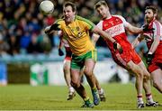 31 January 2015: Michael Murphy, Donegal, in action against Niall Holly, Derry. Allianz Football League Division 1, Round 1, Donegal v Derry. MacCumhail Park, Ballybofey, Co. Donegal Picture credit: Oliver McVeigh / SPORTSFILE