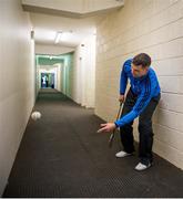 1 February 2015; Dublin's Michael Carton warms his hands while tapping a sliothar around in the corridor beside the dressing rooms. Bord na Mona Walsh Cup, Semi-Final, Laois v Dublin. O'Moore Park, Portlaoise, Co. Laois. Picture credit: Ray McManus / SPORTSFILE