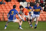 1 February 2015; Aaron Findon, Armagh, in action against Paddy Codd, Robbie Kiely and Peter Acheson, Tipperary. Allianz Football League, Division 3, Round 1, Armagh v Tipperary. Athletic Grounds, Armagh. Picture credit: Oliver McVeigh / SPORTSFILE
