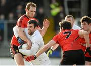 1 February 2015; Padraig O'Neill Kildare, in action against Peter Fitzpatrick, left, and Kevin McKernan, Down. Allianz Football League Division 2 Round 1, Kildare v Down. St Conleth's Park, Newbridge, Co. Kildare. Picture credit: Piaras Ó Mídheach / SPORTSFILE