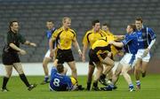 27 October 2007; Tomas O'Se, Munster, and Kevin Cassidy, Ulster, 7, tussel during the match as referee Maurcie Deegan and team-mates, from left, Darragh O'Se, Munster, 8, Dick Clerkin and Sean Cavanagh, Ulster, watch on. M. Donnelly Inter-Provincial Football Championships Final, Munster v Ulster, Croke Park, Dublin. Picture credit: Stephen McCarthy / SPORTSFILE