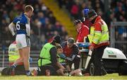 1 February 2015; Evan Regan, Mayo, is attended to by team doctor Dr. Sean Moffatt before leaving the pitch on a stretcher. Allianz Football League, Division 1, Round 1, Kerry v Mayo. Fitzgerald Stadium, Killarney, Co. Kerry.  Picture credit: Brendan Moran / SPORTSFILE