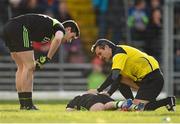 1 February 2015; Referee Maurice Deegan checks on the welfare of Evan Regan, Mayo. Allianz Football League, Division 1, Round 1, Kerry v Mayo. Fitzgerald Stadium, Killarney, Co. Kerry.  Picture credit: Brendan Moran / SPORTSFILE