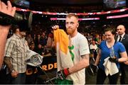 18 January 2015; Paddy Holohan leaves the octagon after defeating Shane Howell in their flyweight bout. UFC Fight Night, Paddy Holohan v Shane Howell, TD Garden, Boston, Massachusetts, USA. Picture credit: Ramsey Cardy / SPORTSFILE
