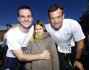 29 October 2007; John Dowling, left, celebrates finishing the marathon with daughter Fiona, age 8, and fellow participant Kia Swobada, from German. adidas Dublin City Marathon 2007, Merrion Square, Dublin. Picture credit: Stephen McCarthy / SPORTSFILE