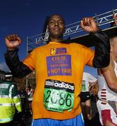 29 October 2007; Adam Kassiem, from Somalia, who was one of twenty Asylum Seeker taking part in the marthon, celebrates after crossing the line during the adidas Dublin City Marathon 2007, Merrion Square, Dublin. Picture credit: Stephen McCarthy / SPORTSFILE