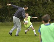 31 October 2007; Former Republic of Ireland International Niall Quinn in action with Jason Byrne and other children from Dublin’s Docklands during the third Docklands Soccer Camp & Mini World Cup Tournament. ALSAA, Dublin Airport, Dublin. Picture credit: Matt Browne / SPORTSFILE  *** Local Caption ***