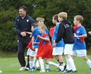 31 October 2007; Former Republic of Ireland International John Aldridge with children from Dublin’s Docklands during the third Docklands Soccer Camp & Mini World Cup Tournament. ALSAA, Dublin Airport, Dublin. Picture credit: Caroline Quinn / SPORTSFILE  *** Local Caption ***