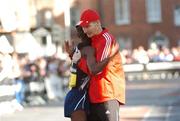 29 October 2007; Second placed Thomas Abyu, from Great Britain, is congratulated by race director Jim Aughney after the race. adidas Dublin City Marathon 2007, Merrion Square, Dublin. Picture credit: Stephen McCarthy / SPORTSFILE