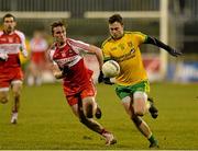 31 January 2015: Martin McElhinney, Donegal, in action against Liam McGoldrick, Derry. Allianz Football League Division 1, Round 1, Donegal v Derry. MacCumhail Park, Ballybofey, Co. Donegal Picture credit: Oliver McVeigh / SPORTSFILE