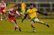 31 January 2015: Odhrán Mac Niallais, Donegal, in action against Liam McGoldrick, Derry. Allianz Football League Division 1, Round 1, Donegal v Derry. MacCumhail Park, Ballybofey, Co. Donegal Picture credit: Oliver McVeigh / SPORTSFILE