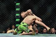 18 January 2015; Conor McGregor right, defends a takedown by Dennis Siver. UFC Fight Night, Conor McGregor v Dennis Siver, TD Garden, Boston, Massachusetts, USA. Picture credit: Ramsey Cardy / SPORTSFILE