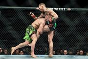 18 January 2015; Conor McGregor right, defends a takedown by Dennis Siver. UFC Fight Night, Conor McGregor v Dennis Siver, TD Garden, Boston, Massachusetts, USA. Picture credit: Ramsey Cardy / SPORTSFILE