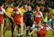 31 January 2015: Referee Marty Duffy in conversation with  Donegal and  Derry players after an incident. Allianz Football League Division 1, Round 1, Donegal v Derry. MacCumhail Park, Ballybofey, Co. Donegal Picture credit: Oliver McVeigh / SPORTSFILE