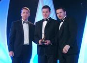 2 November 2007; Conor Gormley of Tyrone is presented with his award by Dave Sheerin, left, MD, Opel Ireland, in the company of Dessie Farrell, Chief Executive of the GPA, at the 2007 Opel GPA Player of the Year Awards. Gaelic Player Assoication Awards, Citywest Hotel, Conference, Leisure & Golf Resort, Saggart, Co. Dublin. Picture credit: Brendan Moran / SPORTSFILE  *** Local Caption ***