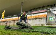 7 February 2015; Groundsman Conor Feehan, from Daingean, Co. Offaly, rolls out a protective mat on the side of the pitch before the game. AIB GAA Hurling All-Ireland Senior Club Championship Semi-Final, Gort v Ballyhale Shamrocks. O’Connor Park, Tullamore, Co. Offaly. Picture credit: Diarmuid Greene / SPORTSFILE