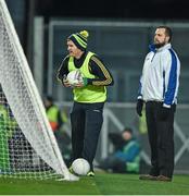 7 February 2015; An umpire looks on as Donegal's Gary McDaid checks the pressure in a ball behind the Hill 16 goal. Allianz Football League, Division 1, Round 2, Dublin v Donegal. Croke Park, Dublin. Picture credit: Ray McManus / SPORTSFILE