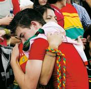 15 July 2007; The Carlow captain Daniel St. Ledger is embraced by his mother Bríd after the game. ESB Leinster Minor Football Championship Final, Laois v Carlow, Croke Park, Dublin. Picture by; Ray McManus / SPORTSFILE from 'A Season of Sundays 2007'      This image may be reproduced free of charge when used in conjunction with a review of the book. All other usage ©SPORTSFILE