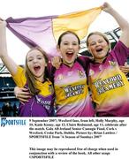 9 September 2007; Wexford fans, from left, Holly Murphy, age 10, Katie Kenny, age 12, Claire Redmond, age 11, celebrate after the match. Gala All-Ireland Senior Camogie Final, Cork v Wexford, Croke Park, Dublin. Picture by; Brian Lawless / SPORTSFILE from 'A Season of Sundays 2007'      This image may be reproduced free of charge when used in conjunction with a review of the book. All other usage ©SPORTSFILE