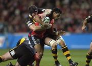 10 November 2007; Lifeimi Mafi, Munster, is tackled by George Skivington and Nick Adams, London Wasps. Heineken Cup, Pool 5, Round 1, London Wasps v Munster, Ricoh Arena, Foleshill, Coventry, England. Picture credit; Matt Browne / SPORTSFILE *** Local Caption ***