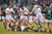 8 February 2015; Aidan O'Shea, Mayo, with, Tyrone players from left Aidan McCrory, Darren McCurry and Ronan McNamee. Allianz Football League, Division 1, Round 2, Mayo v Tyrone, Elverys MacHale Park, Castlebar, Co. Mayo. Picture credit: David Maher / SPORTSFILE