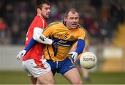 8 February 2015; Pat Burke, Clare, in action against Kevin Toner, Louth. Allianz Football League, Division 3, Round 2, Louth v Clare, Gaelic Grounds, Drogheda, Co. Louth. Picture credit: Pat Murphy / SPORTSFILE