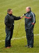 8 February 2015; Cork manager Brian Cuthbert, right, is interviewed by TG4 commentator Marcus Ó Buachalla ahead of the game. Allianz Football League, Division 1, Round 2, Monaghan v Cork, St Mary's Park, Castleblayney, Co. Monaghan. Picture credit: Ramsey Cardy / SPORTSFILE