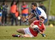 8 February 2015; John O'Rourke, Cork, is tackled by Ryan Wylie, Monaghan. Allianz Football League, Division 1, Round 2, Monaghan v Cork, St Mary's Park, Castleblayney, Co. Monaghan. Picture credit: Ramsey Cardy / SPORTSFILE