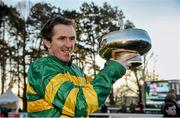 8 February 2015; Jockey Tony McCoy lifts the Gold Cup after winning the Hennessy Gold Cup on Carlingford Lough. Leopardstown, Co. Dublin. Picture credit: Barry Cregg / SPORTSFILE