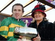 8 February 2015; Jockey Tony McCoy and Noreen McManus with The Hennessy Gold Cup after he rode Carlingford Lough to victory in the Hennessy Gold Cup. Leopardstown, Co. Dublin. Picture credit: Barry Cregg / SPORTSFILE