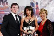 10 November 2007; Caitriona Foley, Cork, is presented with her Energise Camogie All-Star award by the Guest of Honour - Ireland and Leinster rugby player - Gordon D'Arcy in the company of Liz Howard, Uachtarán Chumann Camógaíochta na nGael, at the Energise Sport Camogie All-Star Awards 2007 in association with O'Neills. Citywest Hotel, Conference, Leisure & Golf Resort, Saggart, Co. Dublin. Picture credit: Ray McManus / SPORTSFILE