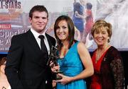 10 November 2007; Jennifer O'Leary, Cork, is presented with her Energise Camogie All-Star award by the Guest of Honour - Ireland and Leinster rugby player - Gordon D'Arcy in the company of Liz Howard, Uachtarán Chumann Camógaíochta na nGael, at the Energise Sport Camogie All-Star Awards 2007 in association with O'Neills. Citywest Hotel, Conference, Leisure & Golf Resort, Saggart, Co. Dublin. Picture credit: Ray McManus / SPORTSFILE