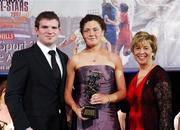 10 November 2007; Claire Grogan, Tipperary, is presented with her Energise Camogie All-Star award by the Guest of Honour - Ireland and Leinster rugby player - Gordon D'Arcy in the company of Liz Howard, Uachtarán Chumann Camógaíochta na nGael, at the Energise Sport Camogie All-Star Awards 2007 in association with O'Neills. Citywest Hotel, Conference, Leisure & Golf Resort, Saggart, Co. Dublin. Picture credit: Ray McManus / SPORTSFILE