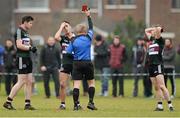 11 February 2015; Referee Ciaran Brannigan shows Ryan Johnston, St Mary's College, a red card after a first half incident as Emmett Bradley, left, and Jerome Johnston look on. Independent.ie Sigerson Cup, Quarter-Final, St Mary's College, Belfast v DCU. St Genevieves High School, Belfast, Co. Antrim. Picture credit: Oliver McVeigh / SPORTSFILE