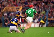 30 April 2000; Andy Moloney of Tipperary holds his face after a collision with Ollie Moran of Limerick during the Church & General National Hurling League Division 1 Semi-Final match between Tipperary and Limerick at Semple Stadium in Thurles, Tipperary. Photo by Ray McManus/Sportsfile