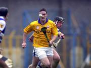 8 April 2000; Andy Moloney of Tipperary in action against David Cuddy of Laois during the Church & General National Hurling League Division 1B Round 6 match between Tipperary and Laois at Semple Stadium in Thurles, Tipperary. Photo by Damien Eagers/Sportsfile
