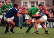 4 March 2000; Anthony Foley of Ireland in action against Andrea De Rossi and Luca Martin of Italy during the Lloyds TSB 6 Nations match between Ireland and Italy at Lansdowne Road in Dublin. Photo by Brendan Moran/Sportsfile