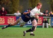 29 April 2000; Anthony Horgan of Cork Constitution is tackled by Gareth Gannon of St Mary's during the AIB All-Ireland League Division 1 match between St Mary's and Cork Constitution at Templeville Road in Dublin. Photo by Matt Browne/Sportsfile