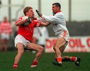 5 March 2000; Anthony Lynch of Cork in action against Steven McDonnell of Armagh during the Church & General National Football League Division 1A Round 5 match between Armagh and Cork at Crossmaglen Rangers GAC Club in Armagh. Photo by Damien Eagers/Sportsfile