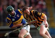 26 March 2000; Andy Comerford of Kilkenny in action against David Kennedy of Tipperary during the Church & General National Hurling League Division 1B Round 4 match between Tipperary and Kilkenny at Semple Stadium in Thurles, Tipperary. Photo by Ray McManus/Sportsfile