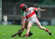 29 April 2000; Kevin O'Sullivan of Kerry in action against Benny Ward of Derry during the Church & General National Hurling League Division 1 Relegation Play-Off match between Kerry and Derry at Parnell Park in Dublin. Photo by Brendan Moran/Sportsfile