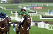 14 March 2000; Charlie Swan celebrates on Istabraq after winning the Smurfit Champion Hurdle Challenge Trophy on Day One of the Cheltenham Racing Festival at Prestbury Park in Cheltenham, England. Photo by Ray Lohan/Sportsfile