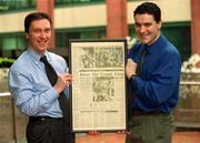 26 April 2000; FAI Cup medal winner Dave Tilson and Neil O'Riordan of The Irish Sun pictured with the newspaper clipping's from the 1992 FAI Cup Final at NCB Stockbrokers, North Dock in Dublin. Photo by Matt Browne/Sportsfile