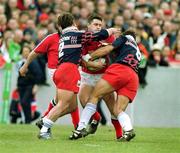 15 April 2000; David Wallace of Munster in action against Fabrice Landreau, left, and Richard Pool Jones of Stade Francais during the Heineken Cup Quarter-Final match between Munster and Stade Francais at Thomond Park in Limerick. Photo by Brendan Moran/Sportsfile