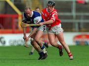 12 March 2000; Declan Conroy of Laois, in action against Pat Ryan of Cork during the Church & General National Hurling League match between Cork and Laois at Pairc Ui Chaoimh in Cork. Photo by Brendan Moran/Sportsfile