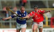 12 March 2000; Declan Conroy of Laois in action against Pat Ryan of Cork during the Church & General National Hurling League match between Cork and Laois at Pairc Ui Chaoimh in Cork. Photo by Brendan Moran/Sportsfile