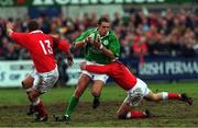 31 March 2000; Dominic Crotty of Ireland is tackled by Delme Williams, right, and Leigh Davies of Wales during the Six Nations A Rugby Championship match between Ireland and Wales at Donnybrook Stadium in Dublin. Photo by Matt Browne/Sportsfile