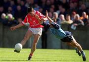9 April 2000; Don Davis of Cork in action against Paul Curran of Dublin during the Church & General National Football League Division 1A match between Dublin and Cork at Parnell Park in Dublin. Photo by Aoife Rice/Sportsfile